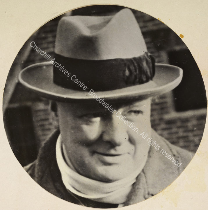 Photo of WSC smiling and wearing a hat and scarf.