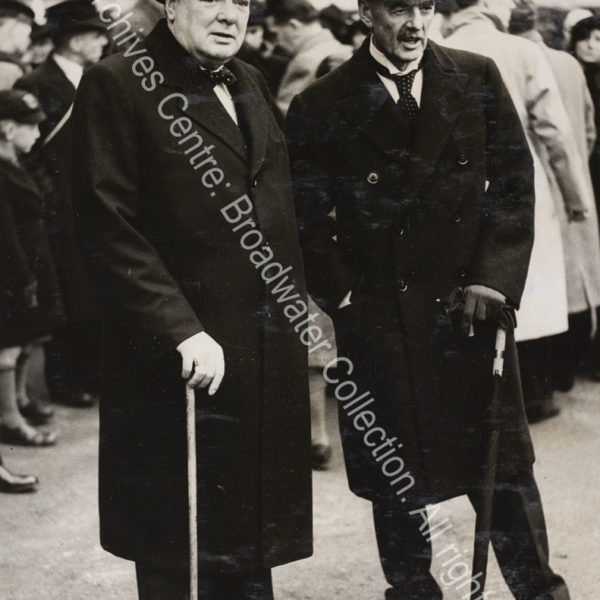 Photo shows WSC and Neville Chamberlain standing together