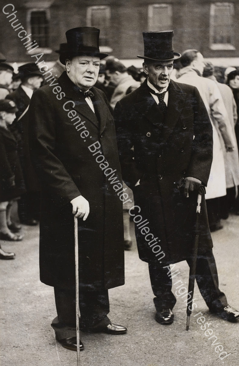 Photo shows WSC and Neville Chamberlain standing together