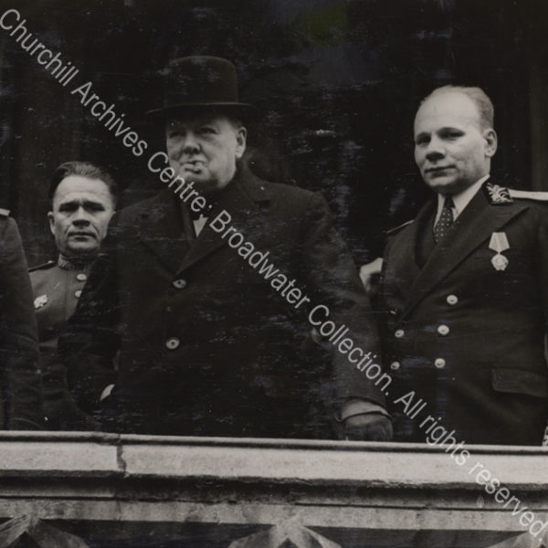 Photo shows WSC wearing and overcoat and hat