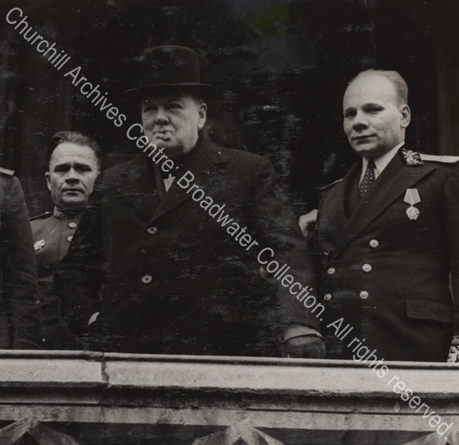 Photo shows WSC wearing and overcoat and hat