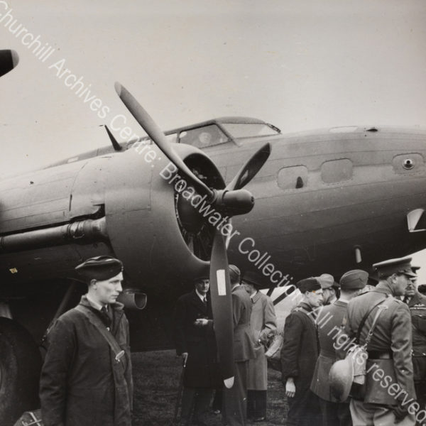 Photo shows WSC in the cockpit of an aeroplane.