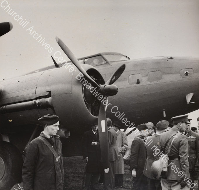Photo shows WSC in the cockpit of an aeroplane.