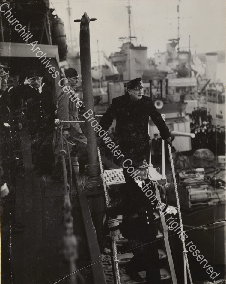 Photo shows WSC about to walking down the steps to leave a ship [?the Duke of York]. Admiral Sir Dudley Pound
