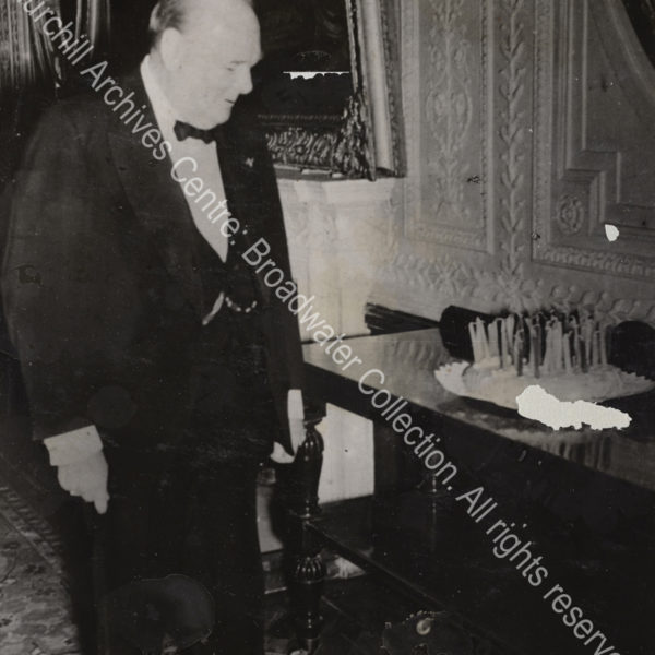 Photo shows WSC looking at a birthday cake.