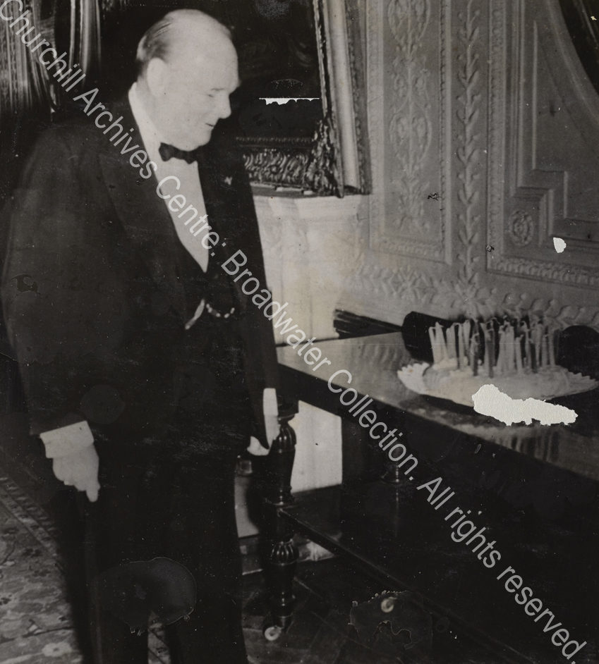 Photo shows WSC looking at a birthday cake.