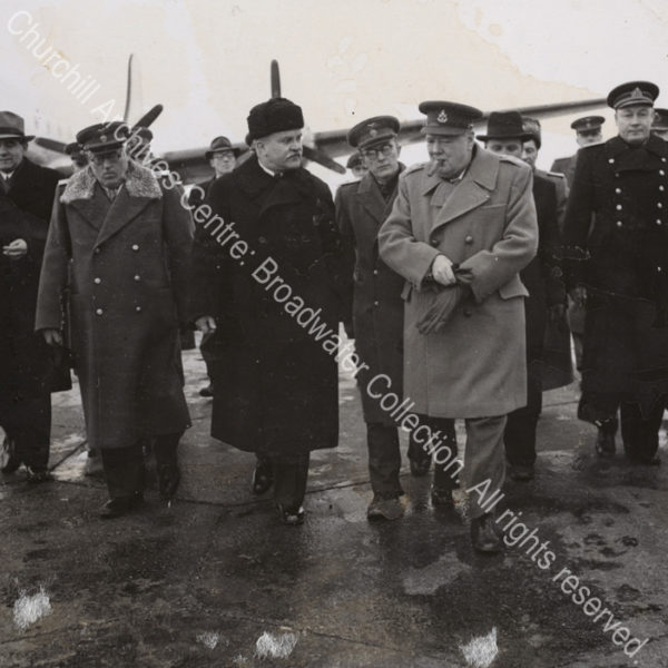 Photo shows WSC wearing an overcoat on arrival in the Soviet Union. He is in conversation with Soviet Foreign Minister Vyacheslav Molotov (wearing a dark greatcoat).