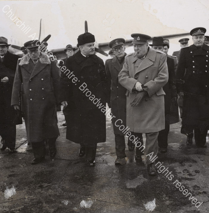 Photo shows WSC wearing an overcoat on arrival in the Soviet Union. He is in conversation with Soviet Foreign Minister Vyacheslav Molotov (wearing a dark greatcoat).
