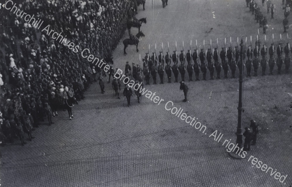 Aerial photograph [? taken by someone in the cathedral] of WSC [Secretary of State for War] inspecting troops.  WSC is in the centre of the photograph