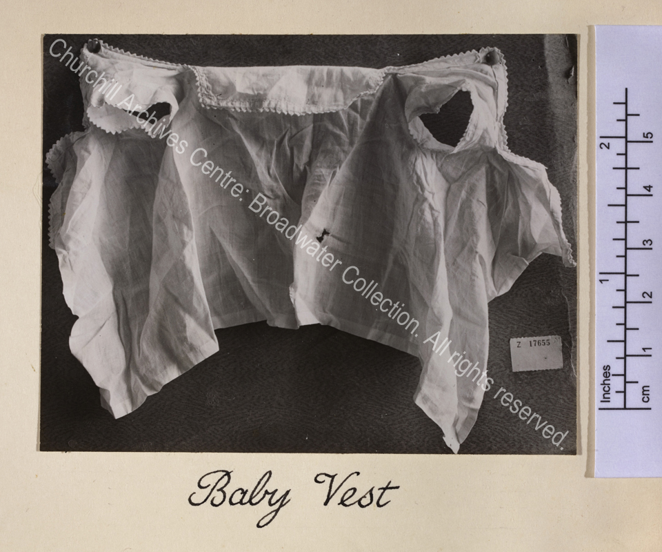 Photograph showing a child's [WSC's] cotton or linen garment pinned out for display.