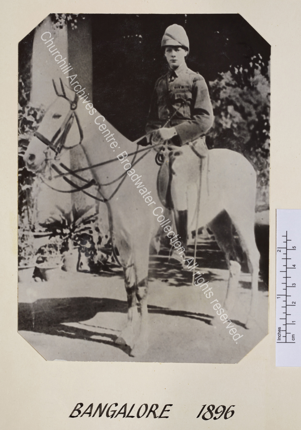 WSC mounted on a grey horse wearing cavalry uniform.