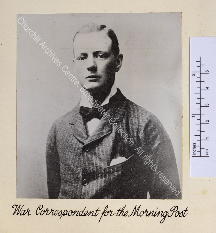 Head and shoulders portrait photograph of WSC wearing a pin-striped suit and a bow tie
