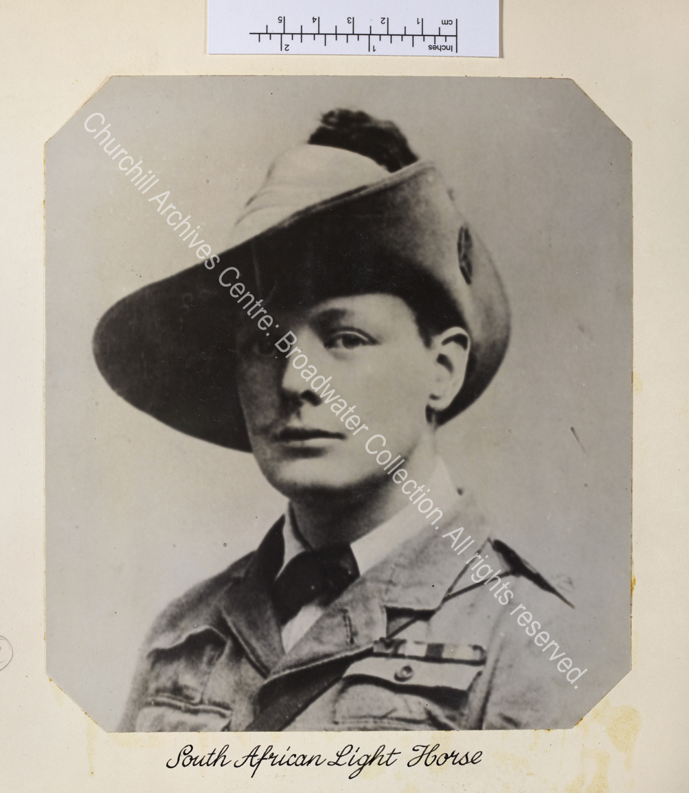 Head and shoulders portrait photograph of WSC with moustache wearing uniform and hat.