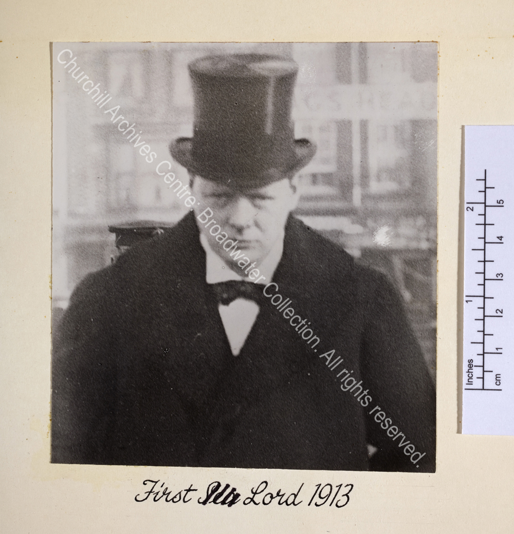 Head and shoulders view of WSC wearing a top hat and overcoat