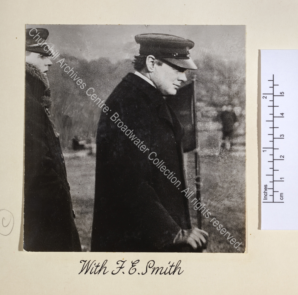 WSC and F E Smith both wearing caps and overcoats seen in profile.