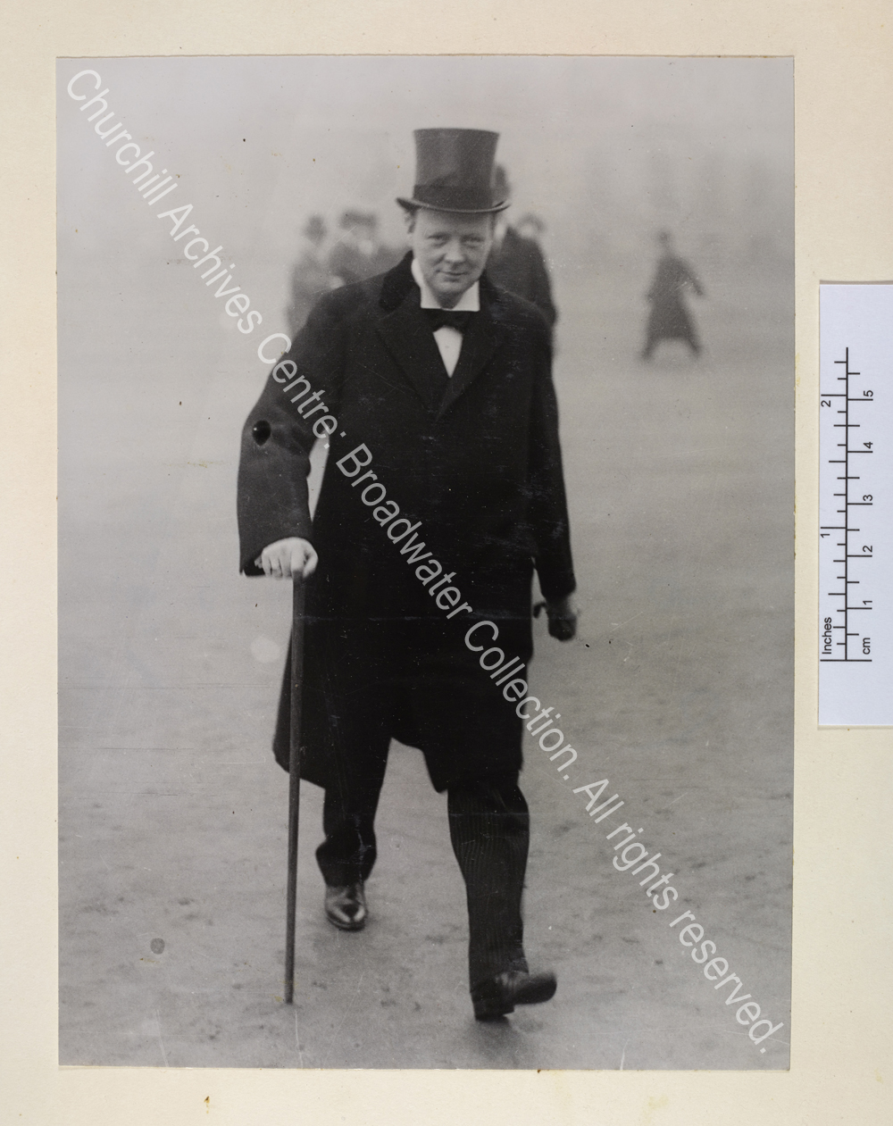 WSC [as First Lord of the Admiralty] striding purposefully with a walking stick