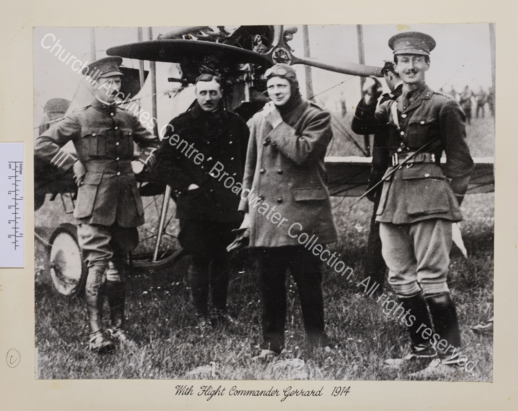 WSC standing with a small group of people in front of the propellor of an aeroplane