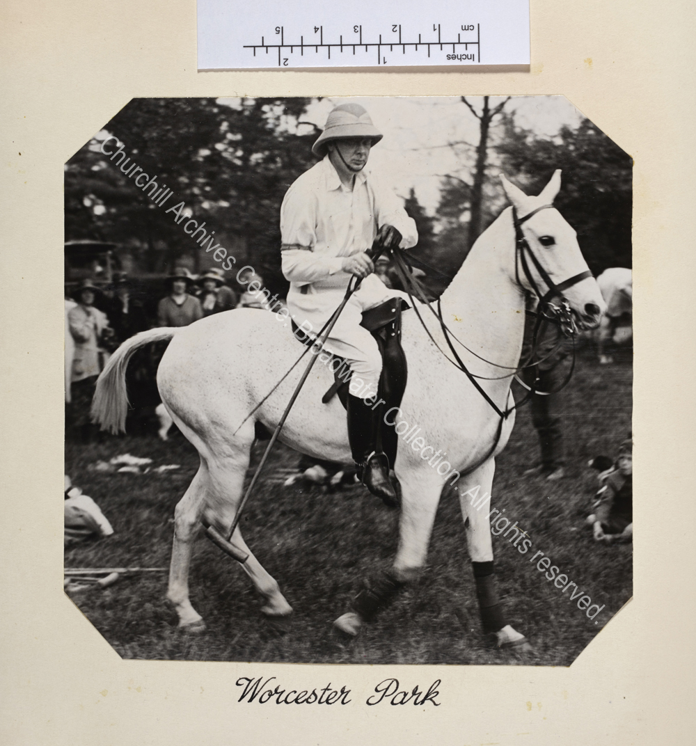 Photo shows WSC riding a grey polo pony