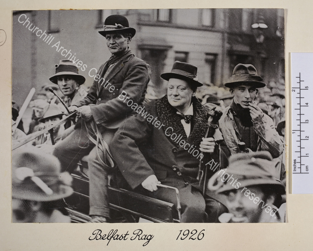 Photo shows WSC being driven in an open horse-drawn carriage.