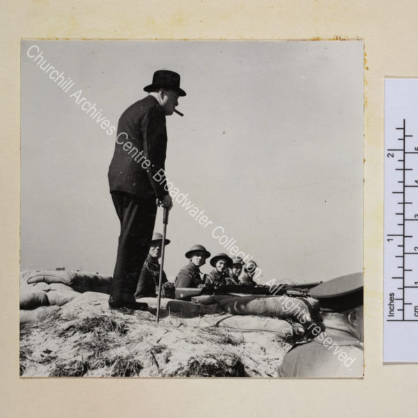 Photo showing WSC in silhouette with a cigar in his mouth