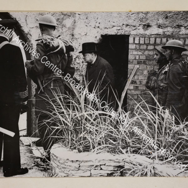 Photo showing WSC coming out of the doorway of a shelter