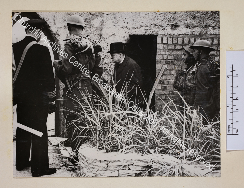 Photo showing WSC coming out of the doorway of a shelter