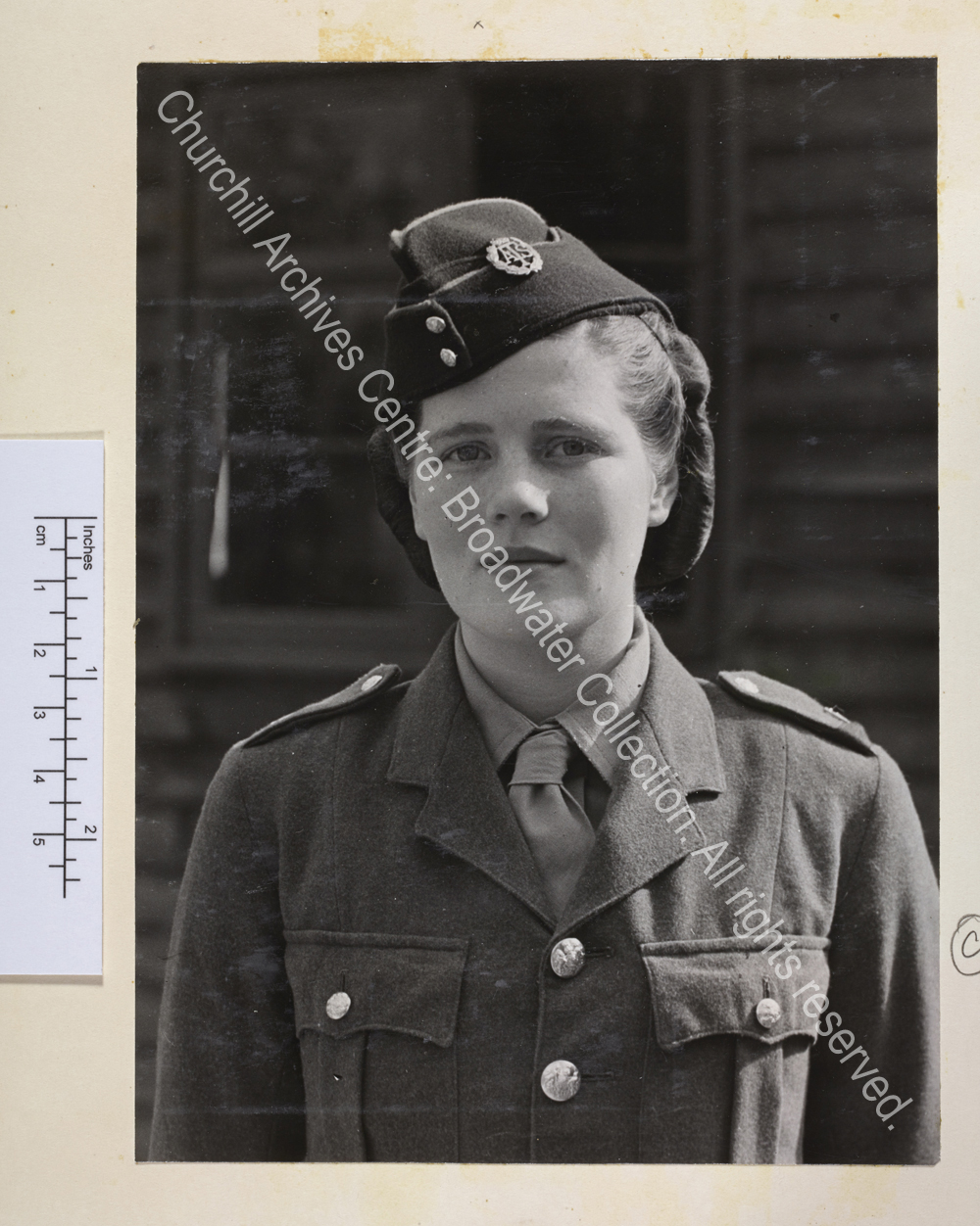 Head and shoulders portrait of Mary Churchill [later Mary Soames] wearing ATS [Auxiliary Territorial Service] uniform and beret.