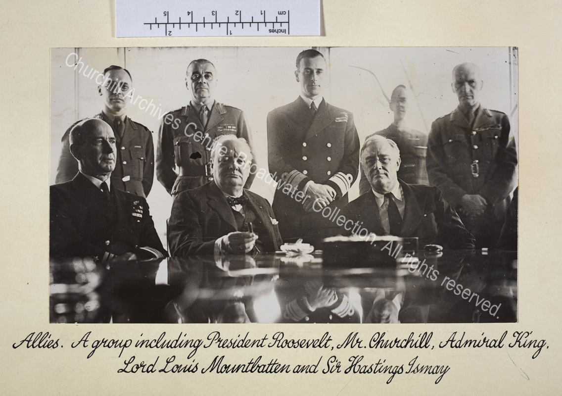 Seated at a table (from left to right): Admiral Ernest King [Commander in Chief United States Fleet and Chief of Naval Operations]