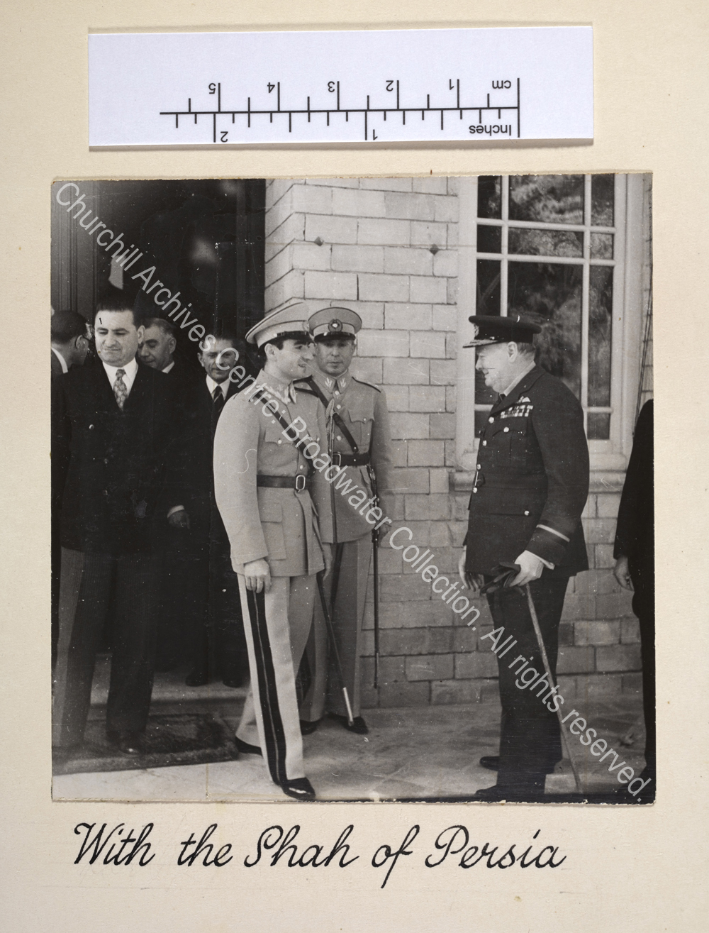 Photo shows the Shah of Persia [Mohammed Reza Pahlavi] greeting WSC in Tehran. Both are in uniform.