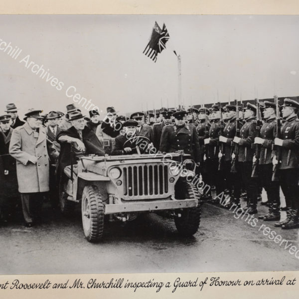 Photo shows WSC and Roosevelt accompanied by a large group of people including Soviet Foreign Minister Vyacheslav Molotov (wearing a dark greatcoat