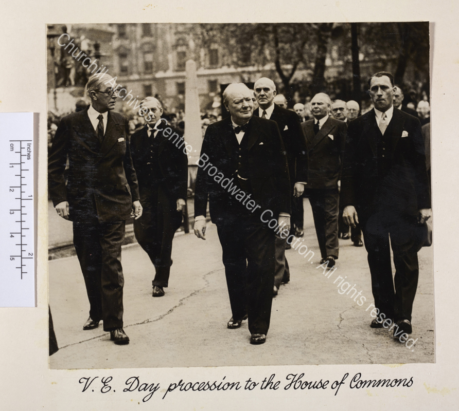 Photo shows WSC walking accompanied by a group of people.
