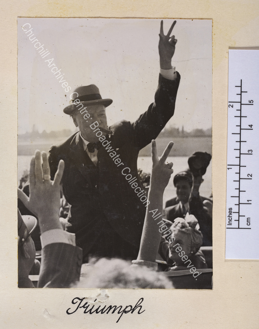 Photo shows WSC standing in an open top car