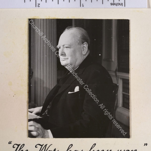 Photo of WSC in profile seated at a desk [in 10 Downing Street to make a broadcast to the nation].