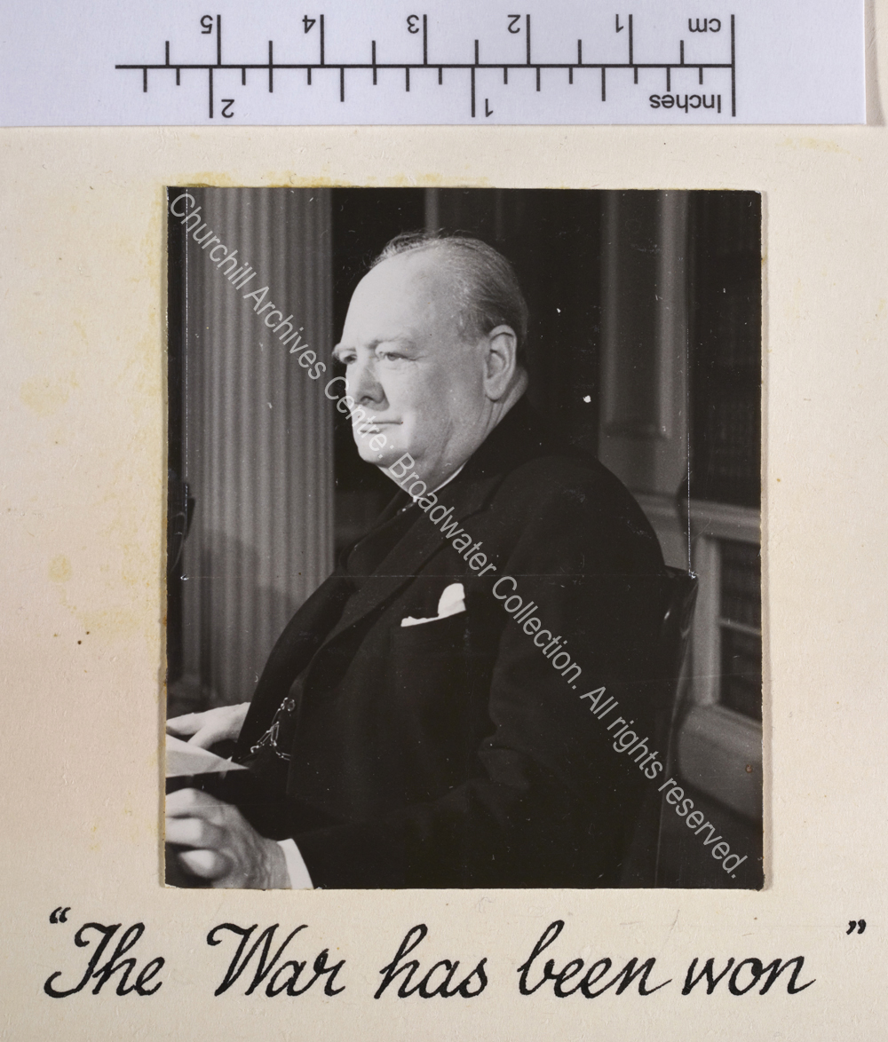 Photo of WSC in profile seated at a desk [in 10 Downing Street to make a broadcast to the nation].