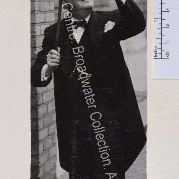 Full length photo of WSC in morning suit and polka dot bow tie