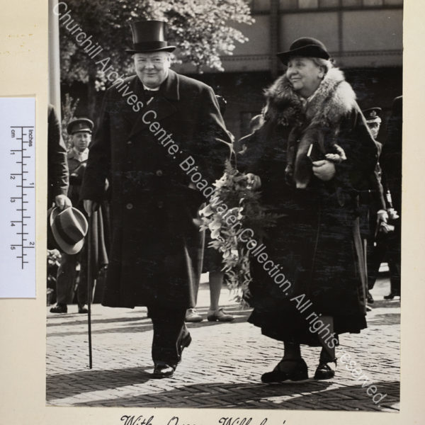 Photograph shows WSC and Queen Wilhelmina walking together