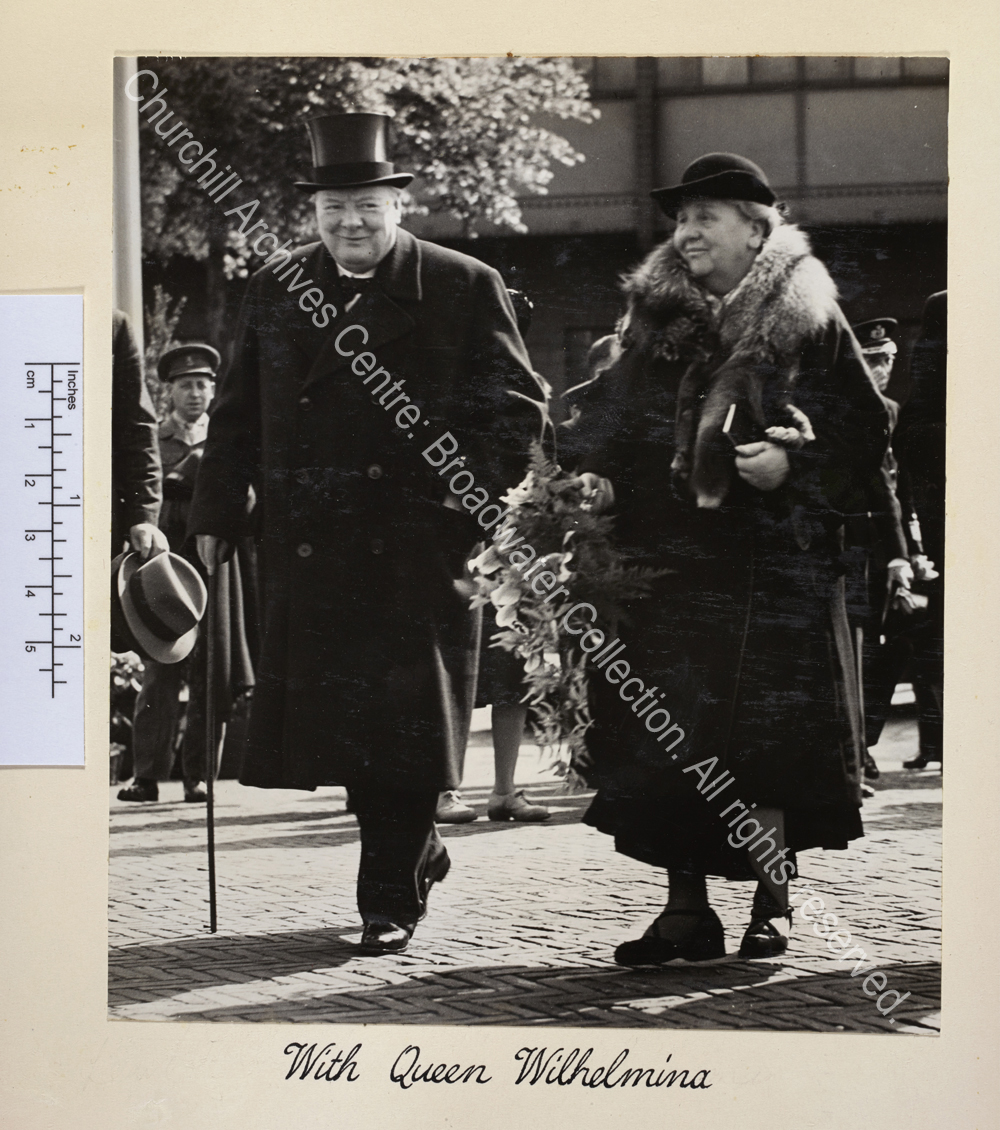 Photograph shows WSC and Queen Wilhelmina walking together