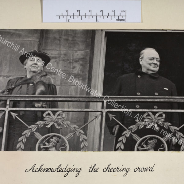 Photo shows WSC and Queen Wilhelmina of the Netherlands standing on a balcony.