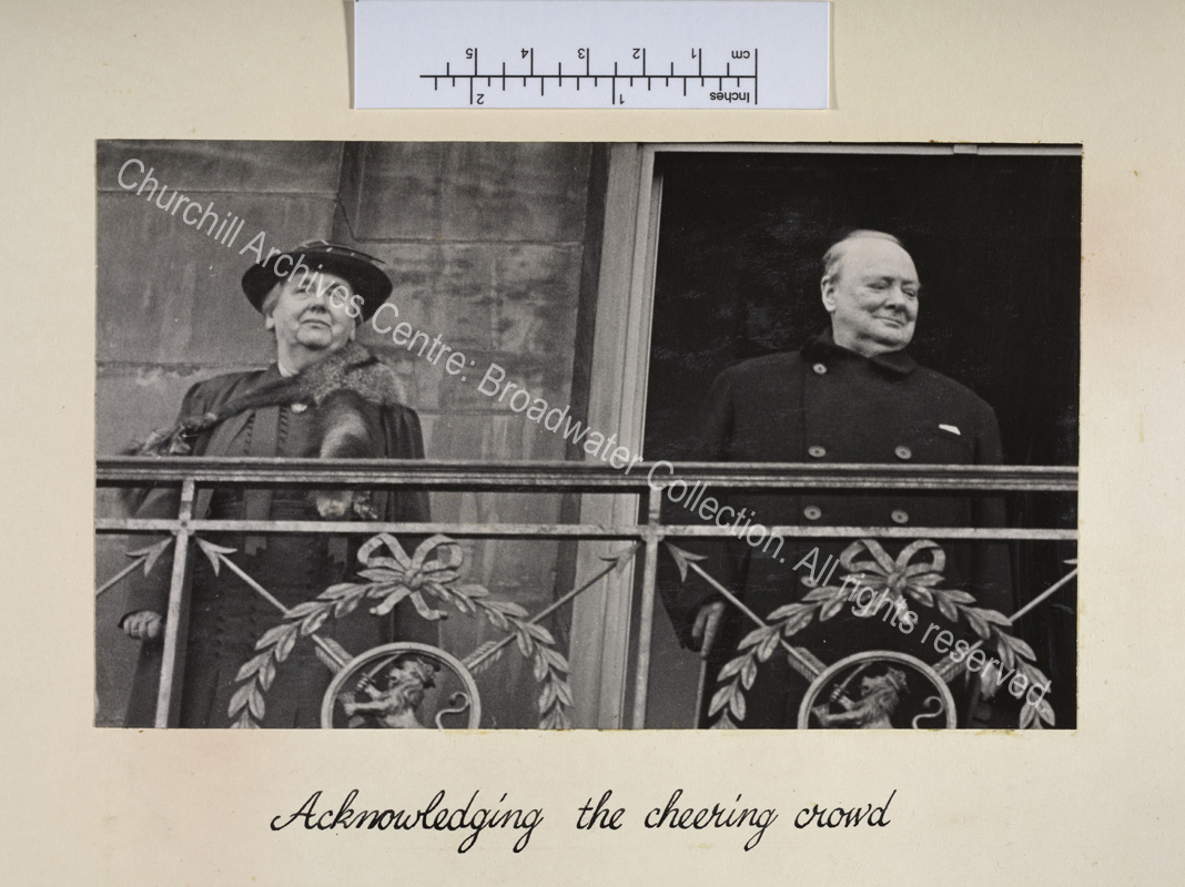 Photo shows WSC and Queen Wilhelmina of the Netherlands standing on a balcony.