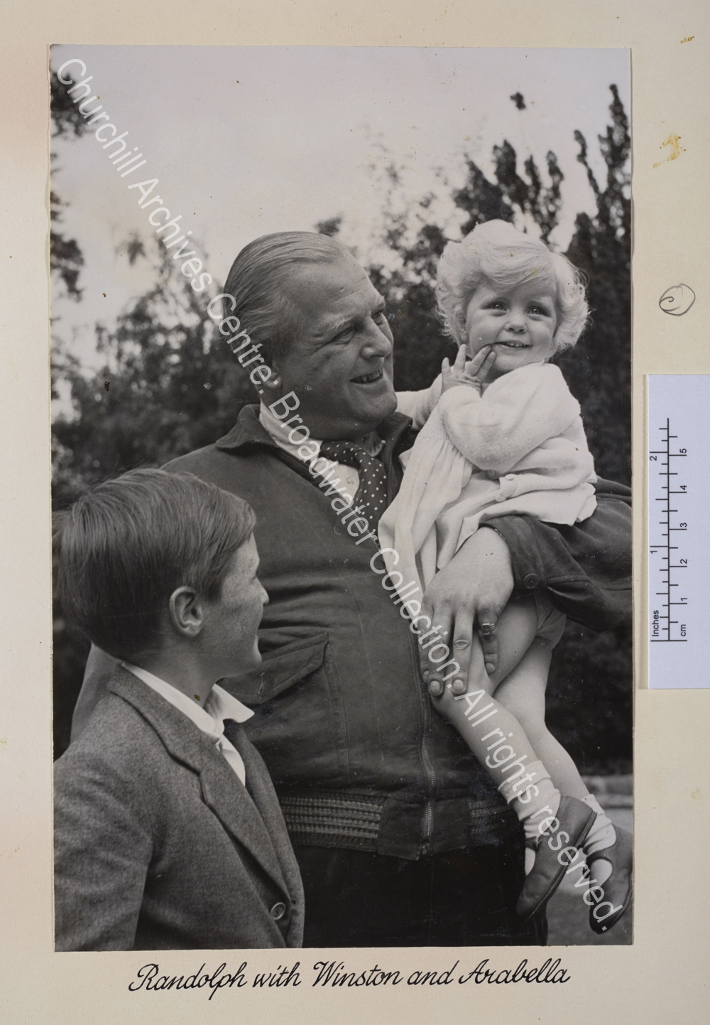 Photo shows Randolph Churchill holding Arabella Churchill in his arms