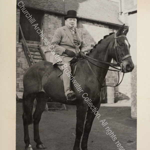 Photo shows WSC mounted on a horse. [The occasion was WSC joining the Surrey and Burstow hunt to celebrate his 74th birthday].