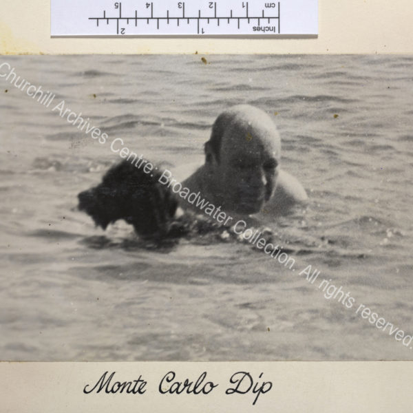 Photo of WSC swimming with a dog. The image is poor quality.