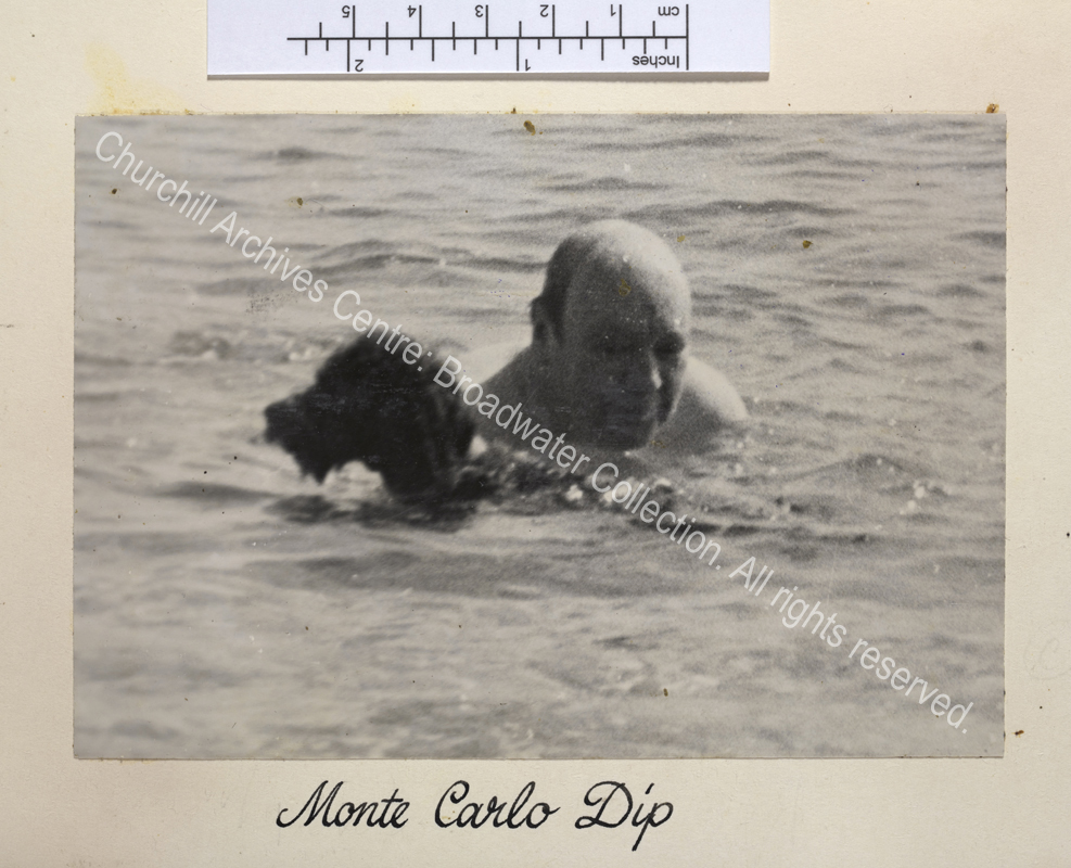 Photo of WSC swimming with a dog. The image is poor quality.