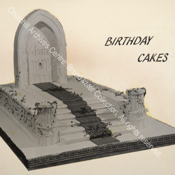 Birthday cake in the shape of a ?church door and steps leading up to it.