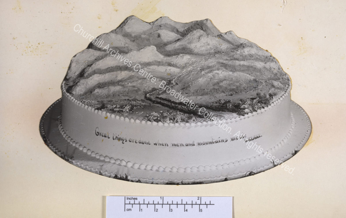 Birthday cake in the shape of a landscape with hills