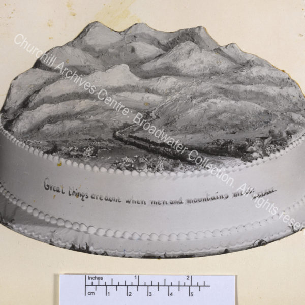 Birthday cake in the shape of a landscape with hills