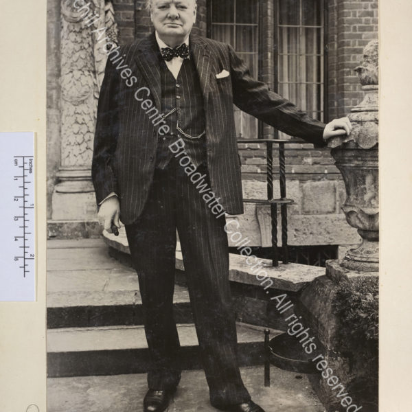 Photo of WSC standing outside the front entrance of Chartwell. He is looking straight to camera