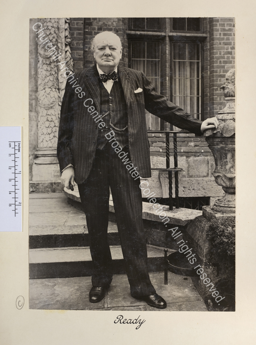 Photo of WSC standing outside the front entrance of Chartwell. He is looking straight to camera