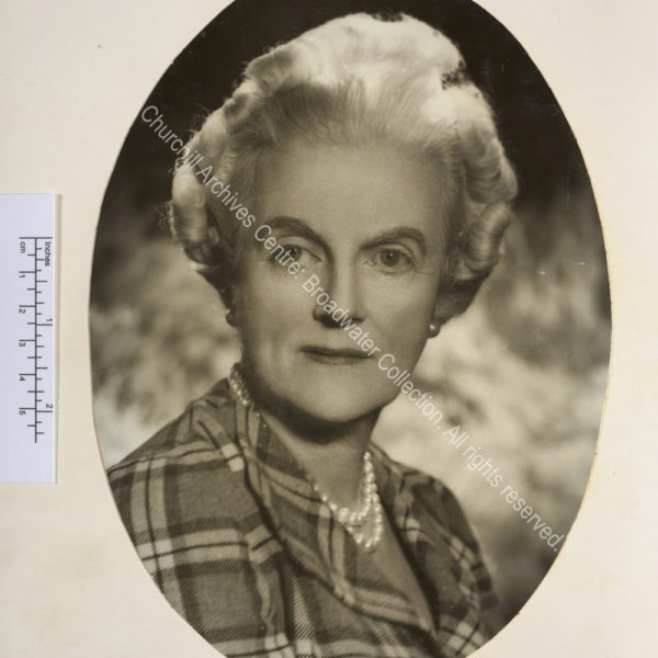 Oval portrait photograph of CSC wearing pearl earrings and necklace and a blouse with a tartan pattern. Possibly by Vivienne [Mrs Florence Entwistle also known as Florence Vivienne Mellish].