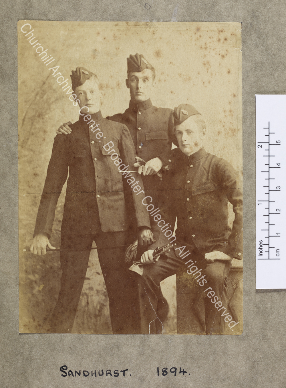 Three-quarter length photograph of WSC with two fellow officer-cadets at the Royal Military College